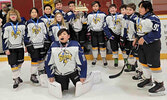 The Under 11 Sioux Storm proudly display their tournament trophy and medals after a busy weekend of hockey at the Sioux Lookout Memorial Arena March 4, 5 and 6.   Sioux Lookout Minor Hockey Association / Submitted Photos