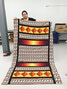 A participant of the sewing program displays the bedcover she created. - Submitted Photo