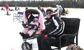Shannon Bowcock and her 15-month-old daughter Mackenzie try their luck at the fishing derby. - Tim Brody / Bulletin Photo