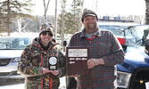 First place winner Nerina Facca (left) accepts her prize from fishing derby coordinator BJ Egerter.  - Tim Brody / Bulletin Photo