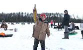 Paul Jr. displays his catch, a 0.81 pound Northern Pike. Paul was one of many children who took part in the fishing derby.   Tim Brody / Bulletin Photo