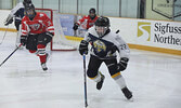 The Sioux Wolverines in action against the Sioux Storm.   Tim Brody / Bulletin Photo