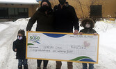 50/50 Charity Draw winner Jeremy Caul (second from right) holding his winning cheque alongside his wife Jaime (second from left)  and children Brooks (far right) and Monroe (far left). - Reeti Meenakshi Rohilla / Bulletin Photo