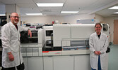 From left: Peter Mayberry, Analytical Laboratory Lead, and Cas Leclerc, Medical Laboratory Technologist, pose alongside one of the new analyzers.    Photo courtesy of Sioux Lookout Meno Ya Win Health Centre