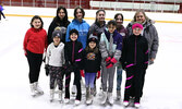 Sioux Lookout Skating Club Head Coach Lynn Traviss-Thompson with club members who attended the Thunder Bay Open competition. - Tim Brody / Bulletin Photo