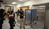 Students take a look at their new cooking class, featuring industrial-size fridges. - Jesse Bonello / Bulletin Photo