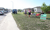 Graduate Nicholas Popovic takes in the parade with his mother Natalie Popovic (centre) and aunt Michelle Diston (left).     Tim Brody / Bulletin Photo