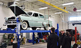 Student tour guide Charles Darling (left) showcased the school’s auto-body shop during a tour. - Jesse Bonello / Bulletin Photo