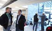 Monteith, Nault and Maud pause to talk in the new high school’s entrance way.  - Tim Brody / Bulletin Photo