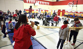 1st Sioux Lookout Scout Group Commissioner Lindsay Young announces calls racers to the track. Parents and guardians took in the action along with their children, who are enrolled in Beavers, Cubs and Scouts. - Tim Brody / Bulletin Photo