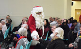 Santa Claus dropped in to visit seniors during the annual Christmas dinner. - Jesse Bonello / Bulletin Photos