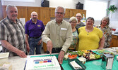 Sioux Area Seniors Activity Centre executive members alongside Sioux Lookout Mayor Doug Lawrance, who cut a special cake on June 1 proclaiming the month as Seniors’ Month. From left: Zeke Schinke, Doug Squires, Mayor Doug Lawrance, Alana Procyk, Boris Pro