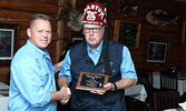 Khartum Shriners Potentate Doug McKechnie (right) presents Anderson’s Lodge co-owner Jody Morin with a plaque expressing the organization’s appreciation for the lodge’s support as it fundraises to help kids. - Tim Brody / Bulletin Photos