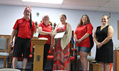 Tara Drew (centre) of Drew Osteopathy accepts a certificate of appreciation from First Lady Lindsey Lorteau (second from left) while Potentate Denis Lorteau (far left) looks on. Drew is joined by members of the Sioux Lookout Shrine Ladies Golf Tournament 