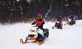 Snowmobilers take to the trails this past January. - Bulletin File Photo