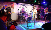 Victor Lyon (foreground) from the Nishnawbe-Gamik Friendship Centre captures Hot Mess’s live performance during the Sioux Mountain online Music Festival. Band members are, from left, Tommy Kuzemczak, Eric Goretzki, McKenna Murphy and Paul Matousek. - Tim 