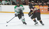 Warriors forward Henry Davis maneuvers his way past an opposing team member as the Warriors took on the St. Thomas Aquinas Saints in the first playoff game of the season at Sioux Lookout Memorial Arena. The Warriors took the game 3-2.   Mike Lawrence / Bu