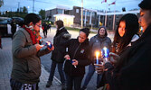 Participants light candles for the Sisters in Spirit Vigil. - Tim Brody / Bulletin Photo