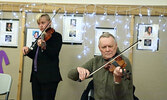 From left: Meritt Penner and Tom Hoppe perform for Sisters in Spirit Vigil participants. - Tim Brody / Bulletin Photo