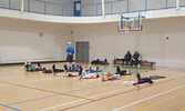 Jory Kettles, in the gymnasium at the Recreation Centre, directing a group of skaters with on mat stretches.   Andre Gomelyuk / Bulletin Photo