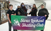 From left: Sioux Lookout Skating Club skater Flint Rattai, Andrea Cospito, draw winner Jessica Morton, Club Fundraising Chair Melissa Slade, and Club President Kim Savoie.   Tim Brody / Bulletin Photo