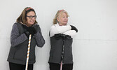 Teammates JoAnn Ford (left) and Cindy Henrickson take in the curling action. Henrickson was one of the event’s top pledge earners raising $2500.   Tim Brody / Bulletin Photo