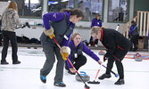 Dori Hopko (left) and Debbie Whalen (right) brush Hailey Goriak’s curling stone down the ice at this year’s Bearskin Airlines Skip to Equip Classic.     Tim Brody / Bulletin Photo