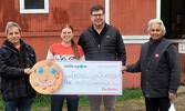 Big smiles at Cedar Bay for the presentation of Tim Hortons Smile Cookie campaign local proceeds to the Friends of Cedar Bay. Pictured from left: Mike O’Brien, representing the Friends of Cedar Bay, accepts a cheque from Chelsea Kent-Beauchamp and William