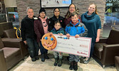Friends of Cedar Bay representatives receive a cheque from Tim Hortons representatives on Dec. 6, proceeds from this year’s Smile Cookie campaign, which in Sioux Lookout supports the work of the Friends of Cedar Bay. Back row from left: Michael O’Brien – 