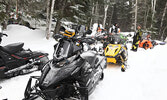 The snowmobiles were lined up in rows, ready for departure, before last year’s Snowarama ride. - Bulletin File Photo