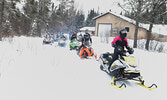 Last years’ Snowarama participants departing from the Ojibway Power Toboggan Association Clubhouse on Abram Lake Road. - Bulletin File Photo