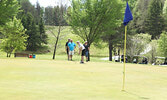 The team from The Standard Insurance putt in, in the four person best ball tournament.      Tim Brody / Bulletin Photo