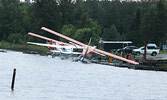 A Slate Falls Airways plane, damaged in the storm.      Tim Brody / Bulletin Photo