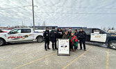 Representatives from the Sioux Lookout OPP, Lac Seul Police Service, and First Step Women’s Shelter conduct the annual Stuff A Cruiser Campaign.    Tim Brody / Bulletin Photo