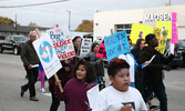 Take Back the Night participants carried signs and shouted messages  condemning violence. - Tim Brody / Bulletin Photos