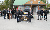 Toys for Tots participants pose for a group photo with some of this year’s donations before heading out on the club’s final ride of the season.   Tim Brody / Bulletin Photo