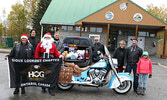 Toys for Tots participants, joined by Santa Claus, prepare to ride their donations to the Nishnawbe-Gamik Friendship Centre, where people can continue to drop off donations. - Tim Brody / Bulletin Photo