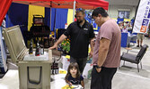 Sioux Lookout Home Hardware Owner/General Manager Eric Bortlis speaks with trade show visitors.   Tim Brody / Bulletin Photo