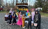 Embers with Sioux Lookout Girls Guides pose for a photo with their trunk.   Tim Brody / Bulletin Photo