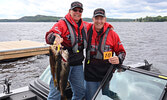 Walleye Weekend participants Dar and Jerry Woods hold up their catch for the first day of the fishing tournament.       Reeti Meenakshi Rohilla / Bulletin Photo