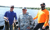 Andre Broulliard (left) and Corey Grenier (centre) with tournament Co-Chair Cory Lago.     Tim Brody / Bulletin Photo