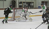 It was fast paced game at the Warriors Alumni Hockey Tournament on December 30. Both teams, a mix of current Warriors players and alumni, kept the pressure on and the final score of 8-7 showcased how evenly matched the teams were.    Mike Lawrence / Bulle