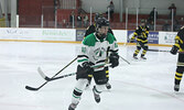 The Warriors battle the Muskies in boys hockey action on Feb. 8.   Tim Brody / Bulletin Photo