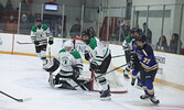 Warriors goalie Zac Lance keeps an eye on the play.    Tim Brody / Bulletin Photo