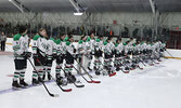 The Warriors Boys and Girls Hockey Teams gathered on the Warrior’s blue line during a special pre-game ceremony to pay tribute to their teammate, Sierra Hoppe.    Tim Brody / Bulletin Photo