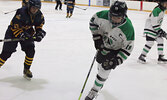 Warriors captain Haylee Bouchard (right) scored three goals for her team in their home opener, earning a hat trick.      Tim Brody / Bulletin Photos