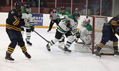 Ava Hoppe (#11) helps clear the puck away from her goalie, Presley Brohm.     Tim Brody / Bulletin Photos