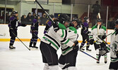 Faith Mousseau (left) and Kiera Schulz celebrate after a Warriors goal. - Jesse Bonello / Bulletin Photo