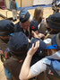Beaver Scouts crowd around Drew inspecting his medals. - Nancy McCord / Submitted Photos
