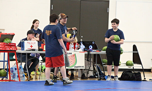 Warrior wrestlers coaches, role models for elementary athletes